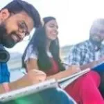Indian friends sitting on stairs outdoors with copybooks thumbnail